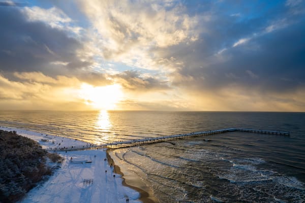 Aerial winter sunny frozen day view of snowy resort Palanga, Lithuania