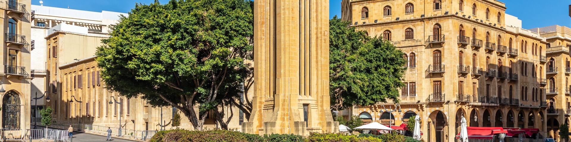 Al-Abed Nejmeh Square clock tower with tree and buildings around, Beirut, Lebanon