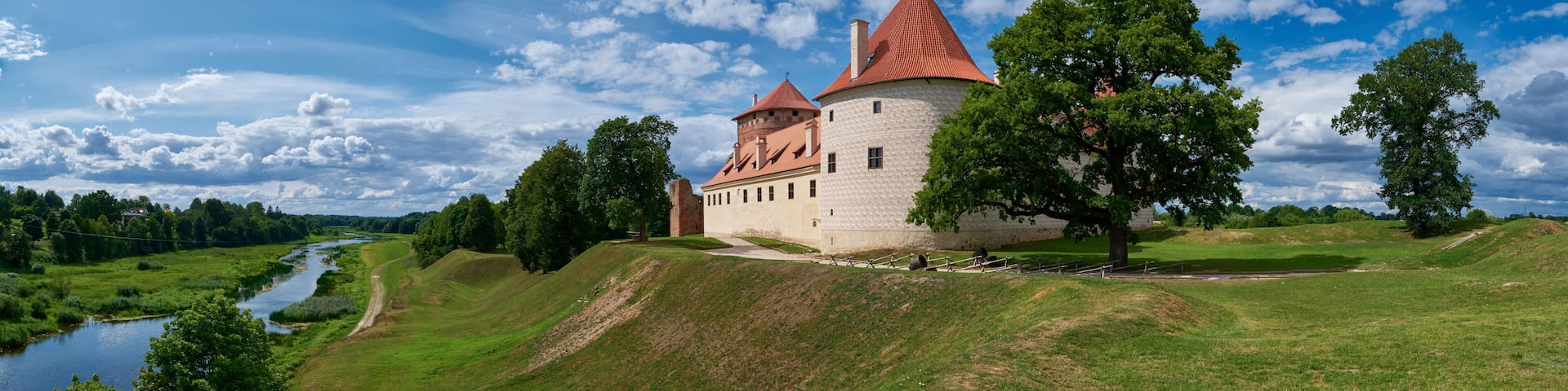 Panoranic view of latvian tourist landmark attraction - ruins of medieval Bauska castle and the remains of a later palace, located between the Memel and Musa rivers. Bauska, Latvia.