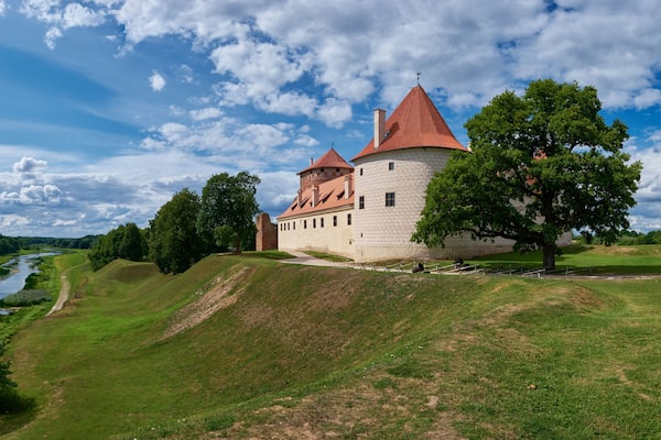 Panoranic view of latvian tourist landmark attraction - ruins of medieval Bauska castle and the remains of a later palace, located between the Memel and Musa rivers. Bauska, Latvia.