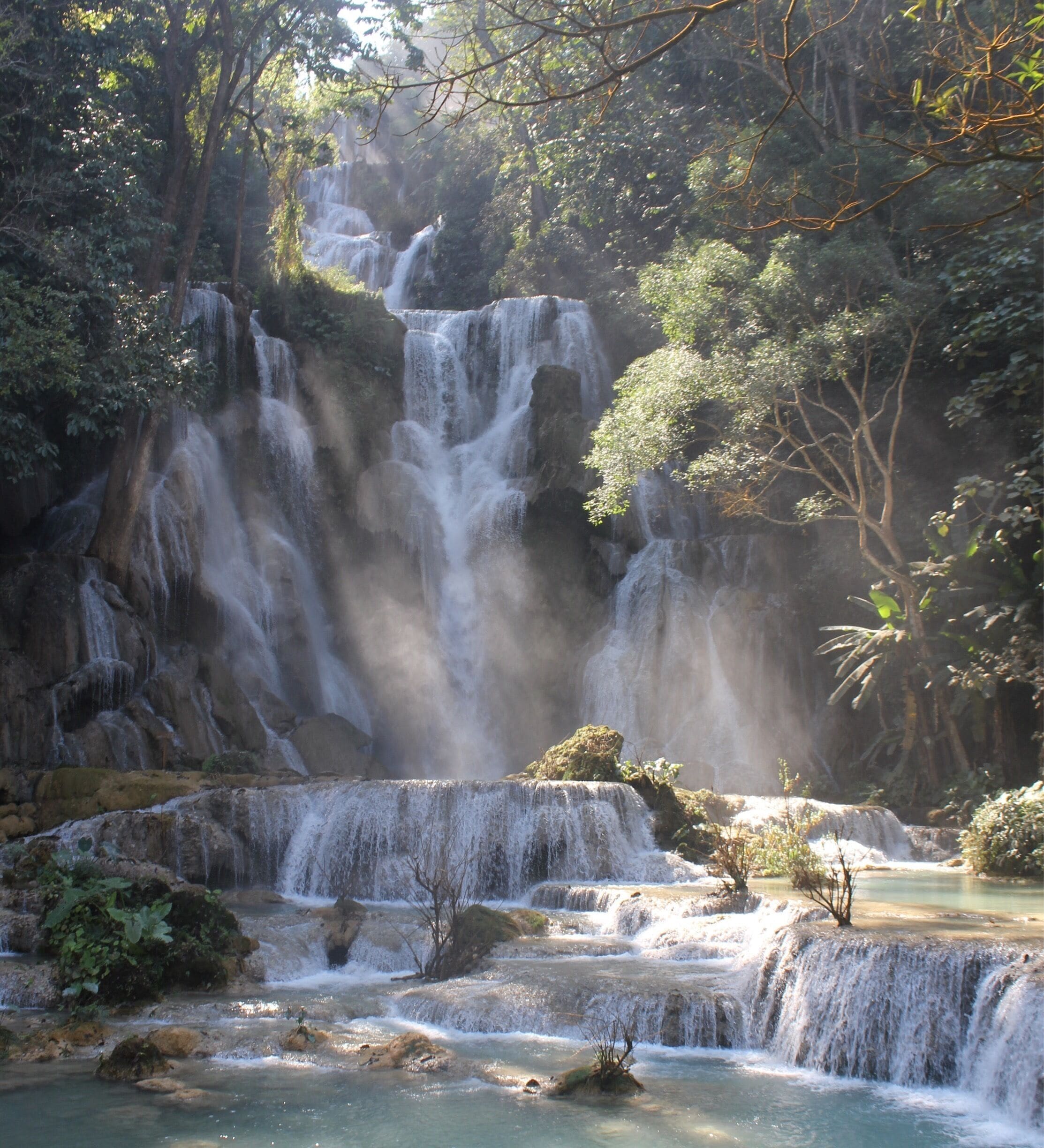 Beautiful water fall! I love the sunlight filtering through the trees!