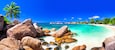 Panoramic view of Anse Lazio beach with granite rocks and turquoise ocean, Praslin Island, Seychelles. Most beautiful tropical paradise coastline at sunny day.