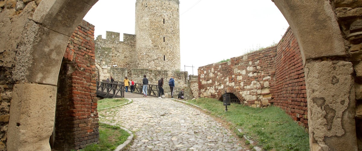 Kalemegdan Citadel featuring heritage elements and a bridge as well as a small group of people