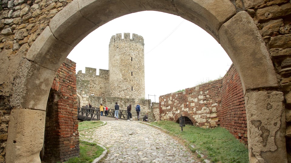 Kalemegdan Citadel featuring a bridge and heritage elements as well as a small group of people