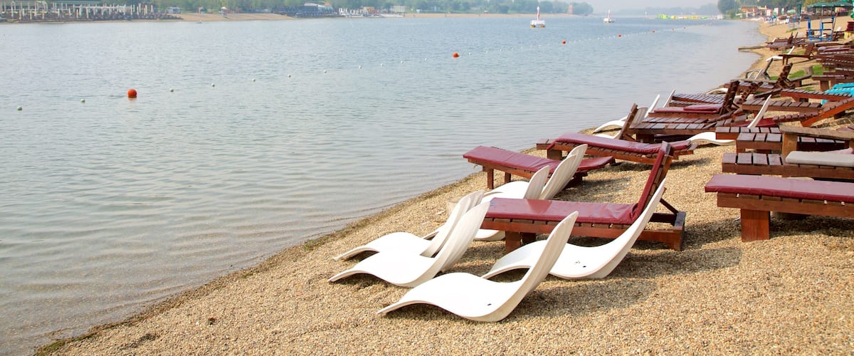 Ada Ciganlija which includes general coastal views and a beach