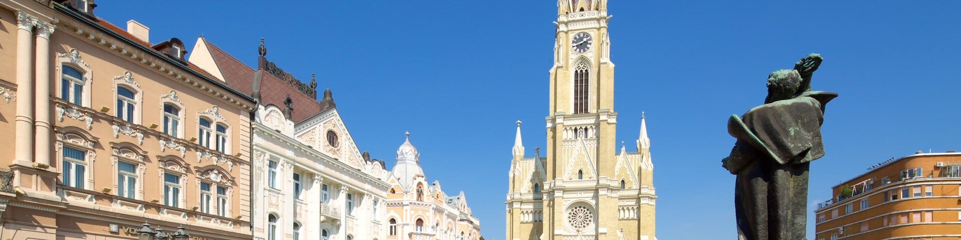 Church of the Virgin Mary showing a statue or sculpture, street scenes and a square or plaza