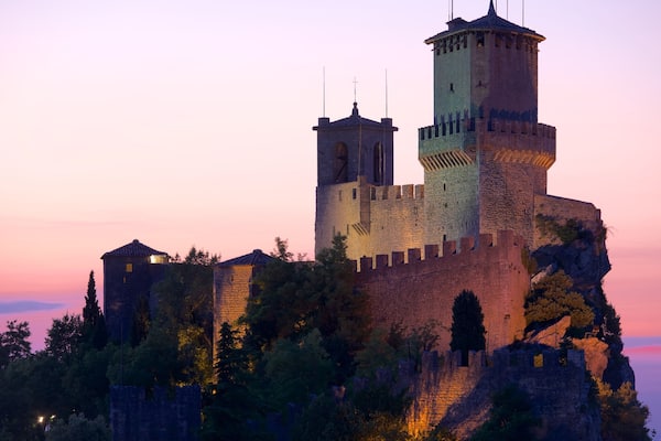 Guaita Tower showing a sunset, chateau or palace and heritage elements