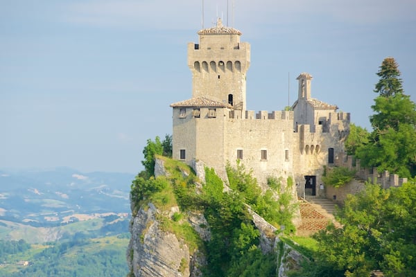 Guaita Tower which includes a castle, heritage elements and tranquil scenes