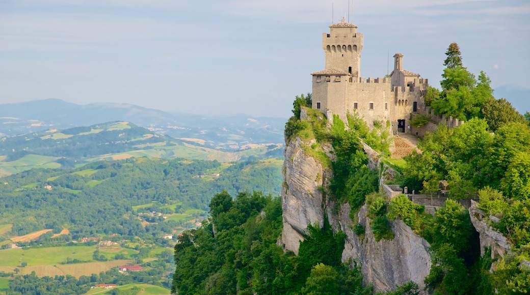 Guaita Tower showing a castle, tranquil scenes and mountains