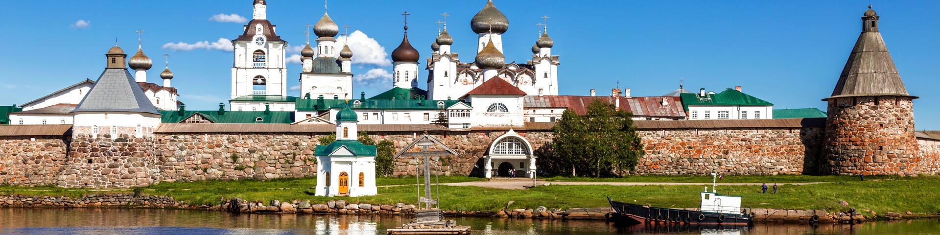 Spaso-Preobrazhensky the Solovetsky Stavropegial monastery with worship the cross in the bay of Well-being on the Bolshoy Solovetsky island in the White sea. Arkhangelsk region, Russia