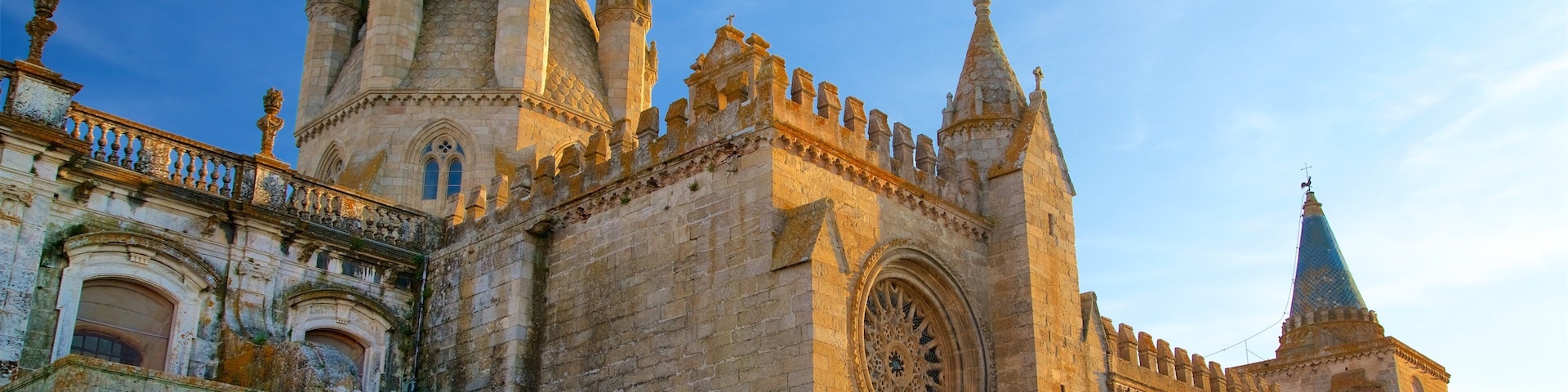 Evora Cathedral featuring a sunset, heritage architecture and a church or cathedral