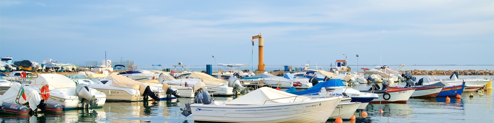 Olhao Harbour featuring a bay or harbor
