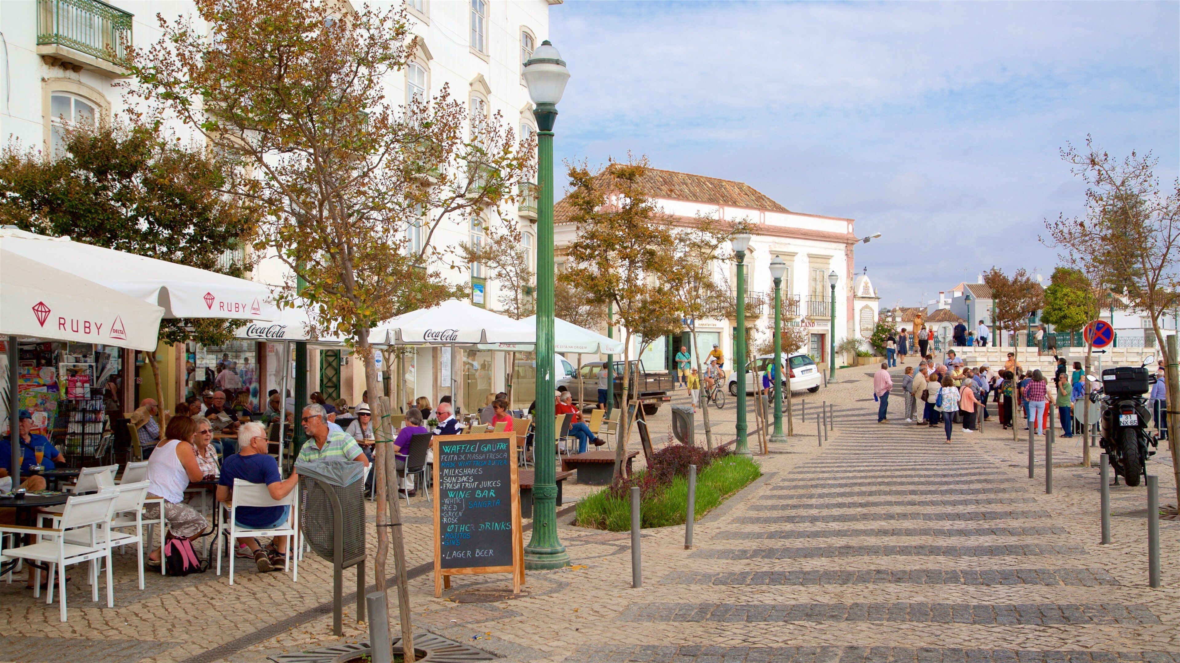Praca da Republica which includes outdoor eating as well as a small group of people