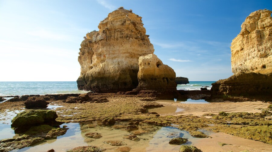 Sao Rafael Beach which includes rugged coastline, a sandy beach and general coastal views