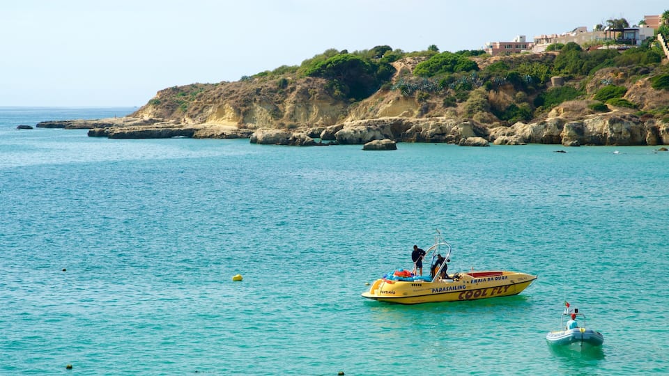 Oura Beach featuring boating, rugged coastline and general coastal views