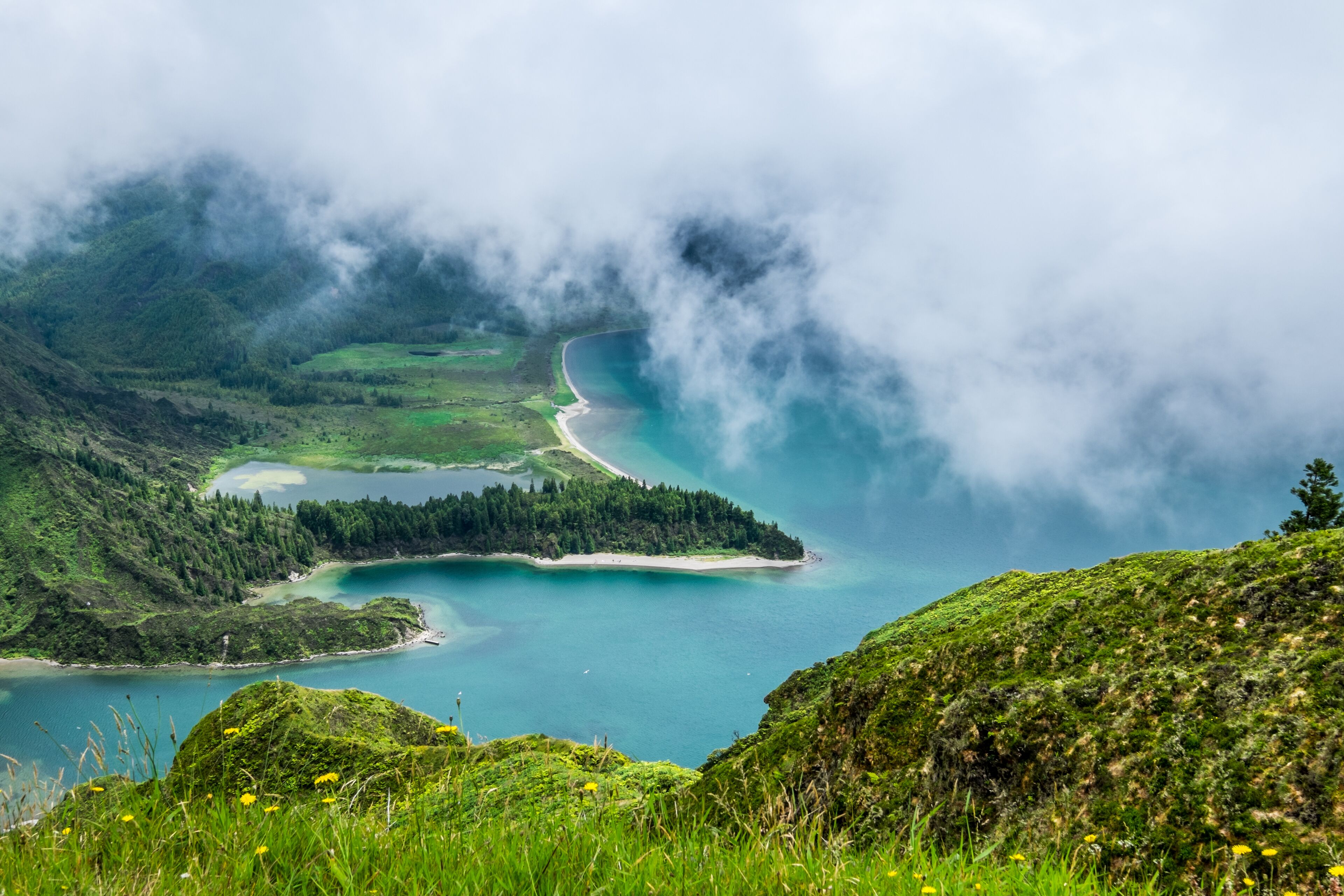 Lagoa do Fogo, a volcanic lake in Sao Miguel, Azores under the dramatic clouds
