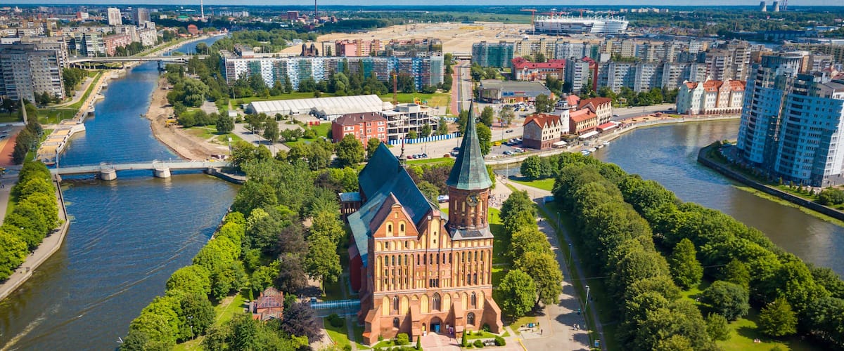 Aerial cityscape of Kant Island in Kaliningrad, Russia at sunny summer day with white clouds in the blue sky
