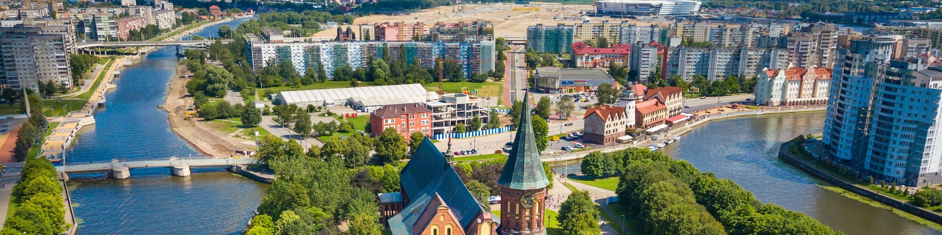 Aerial cityscape of Kant Island in Kaliningrad, Russia at sunny summer day with white clouds in the blue sky