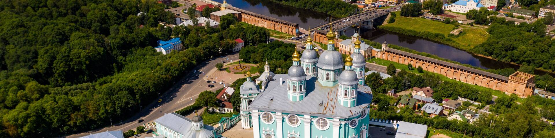 city panoramic landscape in summer with a temple on a hill filmed from a drone