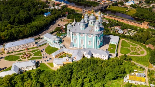 city panoramic landscape in summer with a temple on a hill filmed from a drone