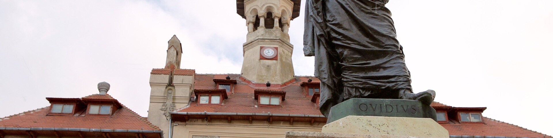 Ovid Square which includes a statue or sculpture and heritage architecture