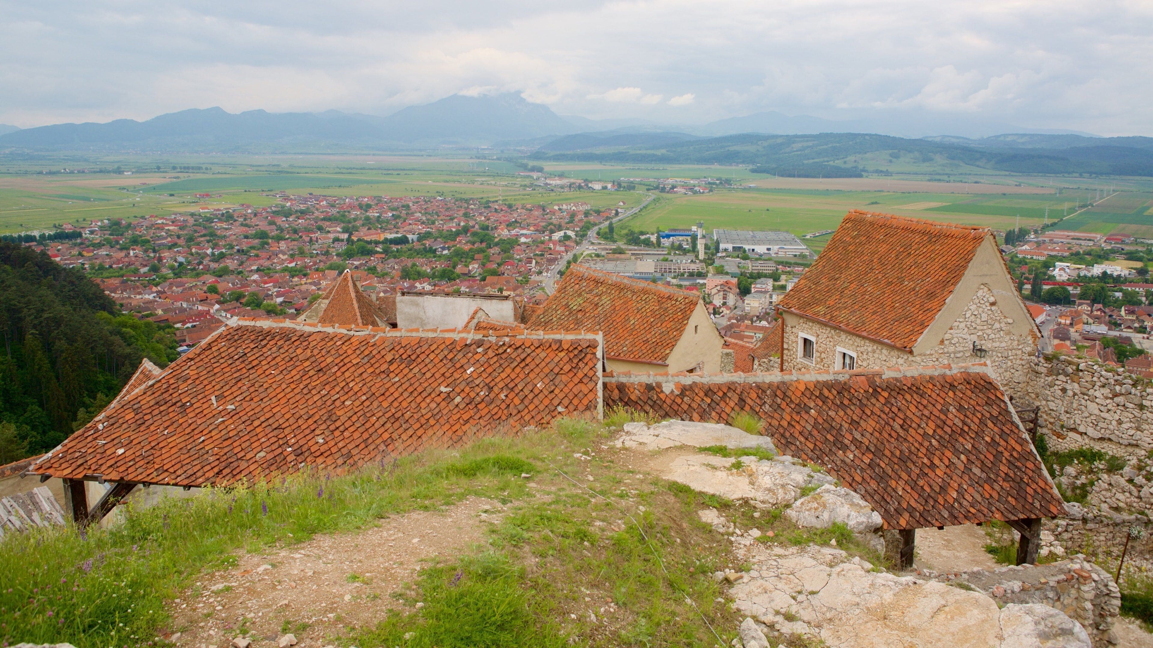 Rasnov Fortress featuring a small town or village and a house