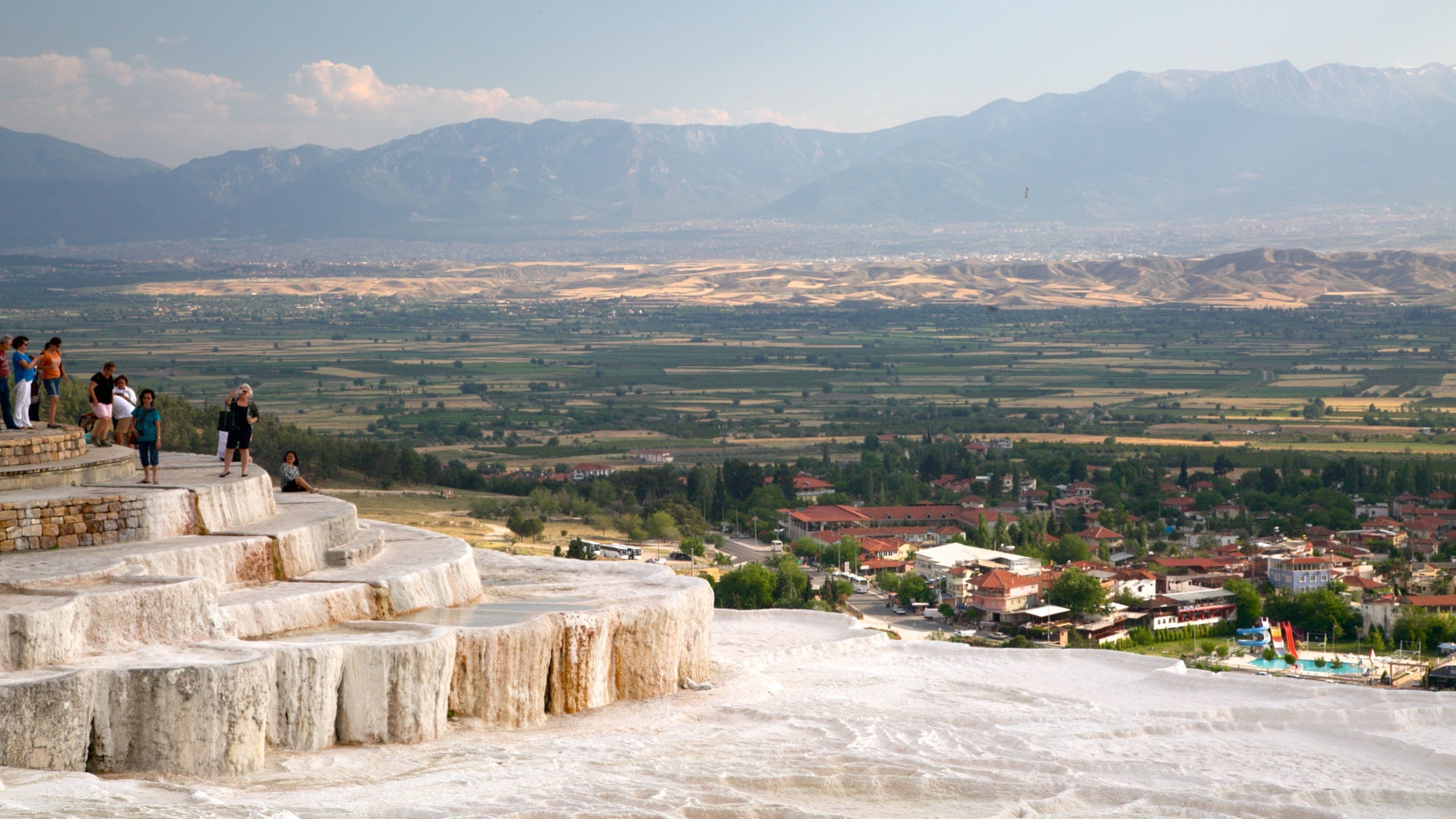 Pamukkale Thermal Pools which includes a hot spring as well as a small group of people