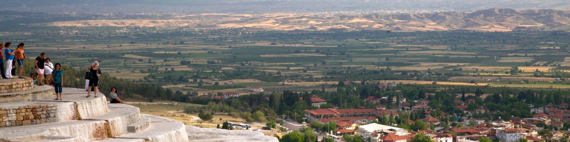 Pamukkale Thermal Pools which includes a hot spring as well as a small group of people
