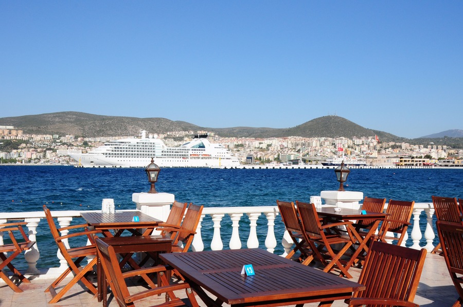 Perfect dinner spot on a terrace in Kusadasi Turkey with a beautiful cruise ship in the background