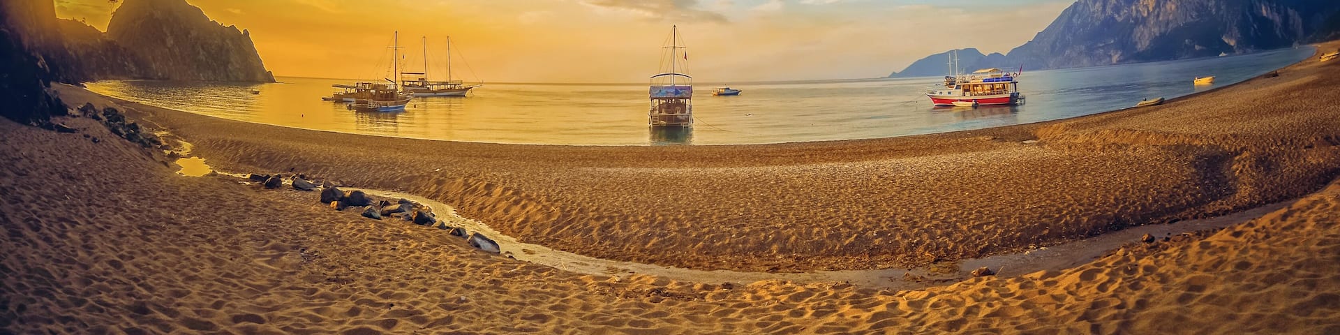 Colorful sea beach sunrise. Panoramic Olympos Beach, Cirali, Turkey