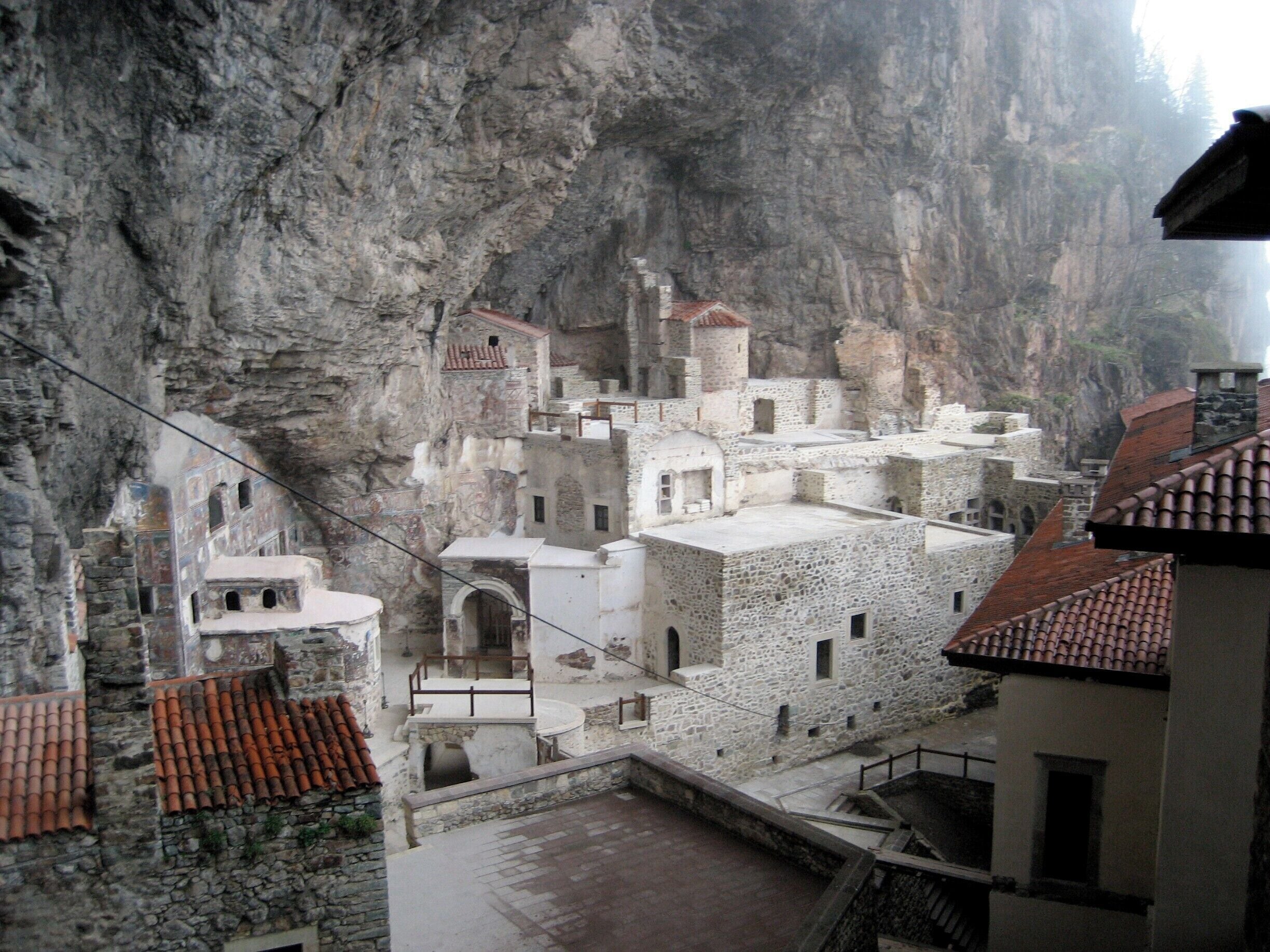 This is the Sumela monastery out of Trabzon. What looks like just a facade hanging on the cliff face encloses a whole village within. The wire you see is a flying fox to get materials in and out of the steep entrance. #Trove on #Architecture #Details This is truly a hidden gem on the inside. 