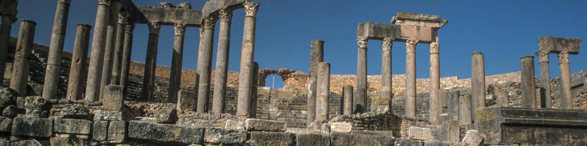 #Detail
Inscription, Roman theatre, in the Romano Berber city of Dougga.
A Unesco world heritage site, and the best preserved of all such sites, in North Africa.
Due mainly to it's remote location.