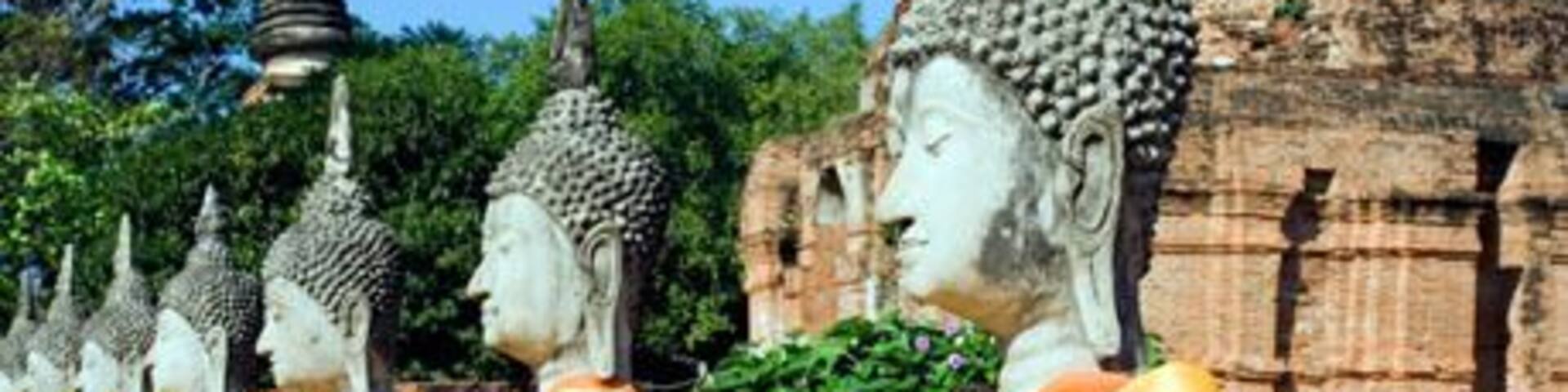 A row of Buddha statues at the temple of Wat Yai Chai Mongkol in Ayutthaya near Bangkok Thailand. Image shot 2006. Exact date unknown.
