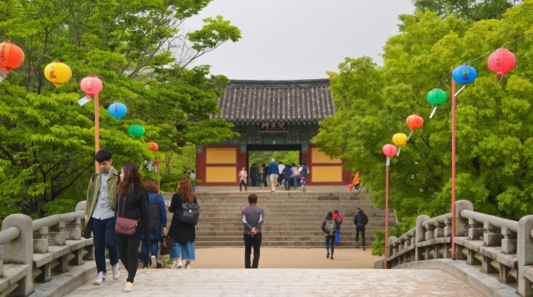 Bulguksa Temple featuring a bridge and a park as well as a couple
