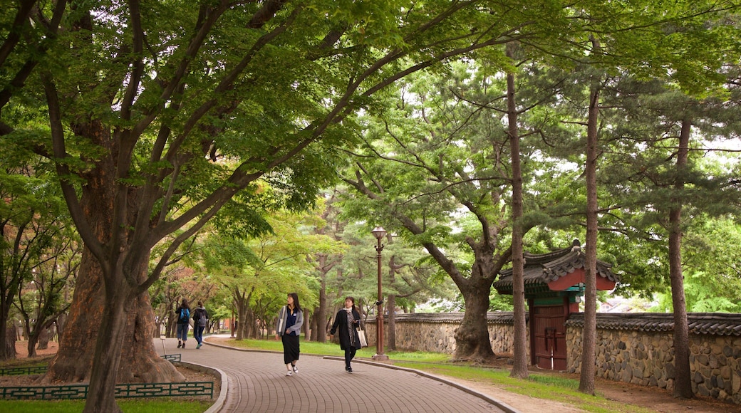 Tumuli Park featuring a garden as well as a couple