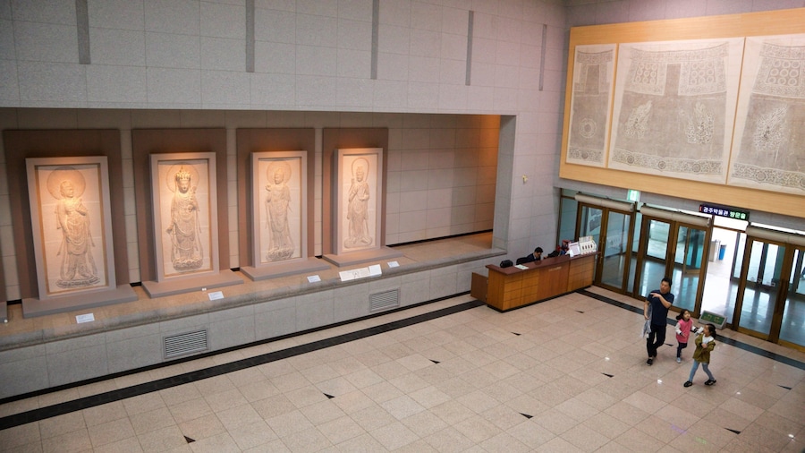 Gyeongju National Museum featuring interior views as well as a family