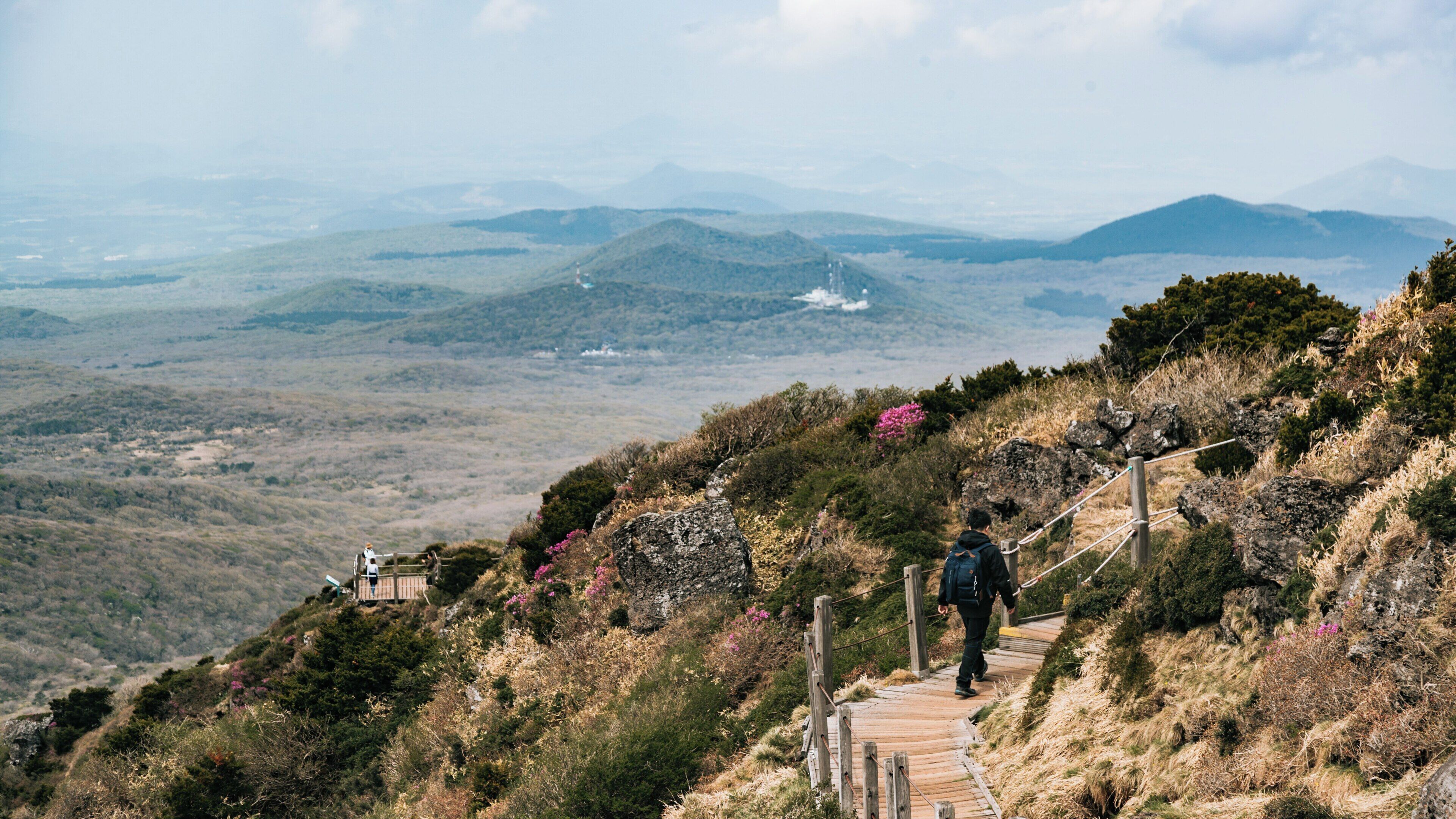 Mountaineering at Hallasan National Park in Jeju City, exploring natural beauty and panoramic views of the valleys