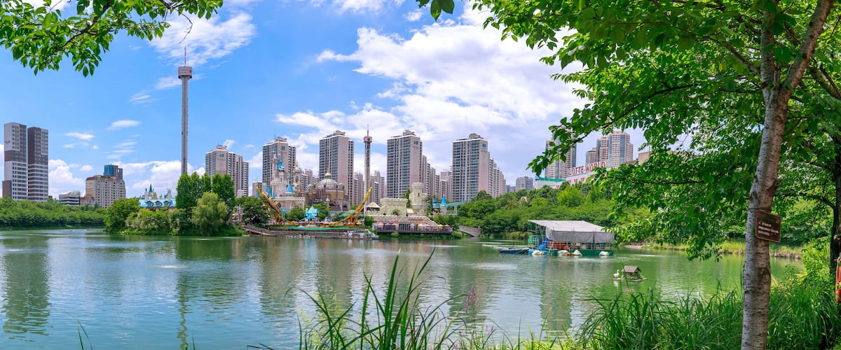 Lotte World amusement theme park around Seokchon lake, a major tourist attraction in Seoul, South Korea.