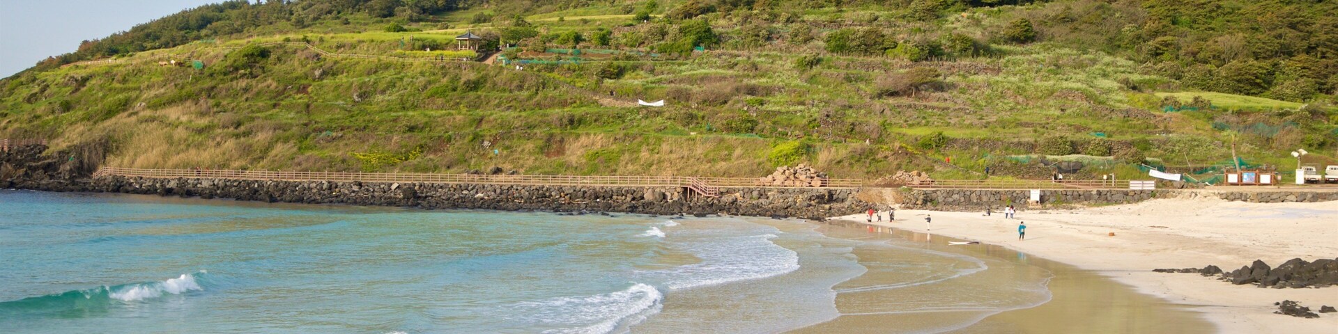 St Maarten and St Martin which includes general coastal views and a beach
