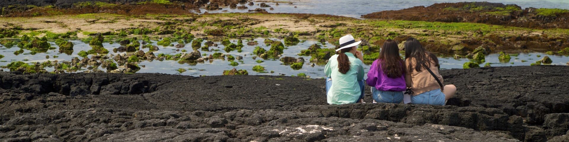 Hyeopjae Beach which includes general coastal views as well as a small group of people