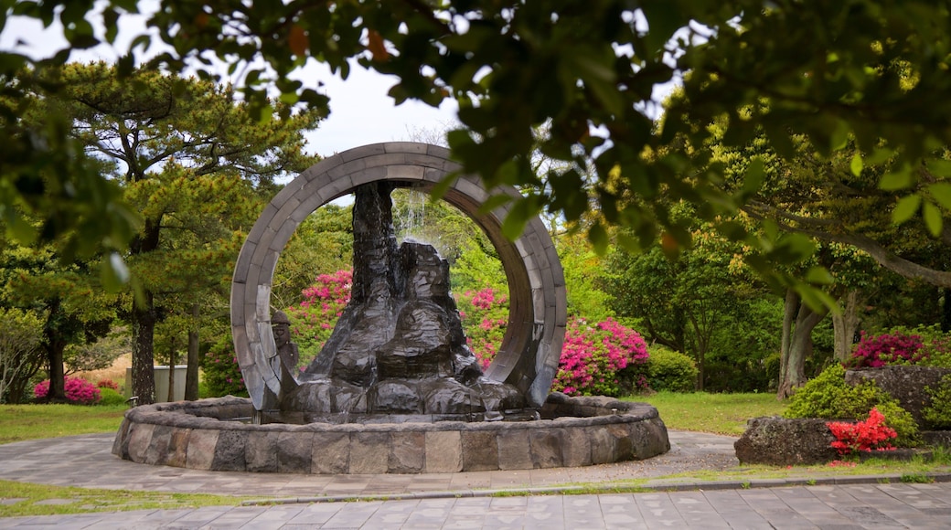 Manjanggul Lava-tube Cave which includes wildflowers, a garden and a fountain