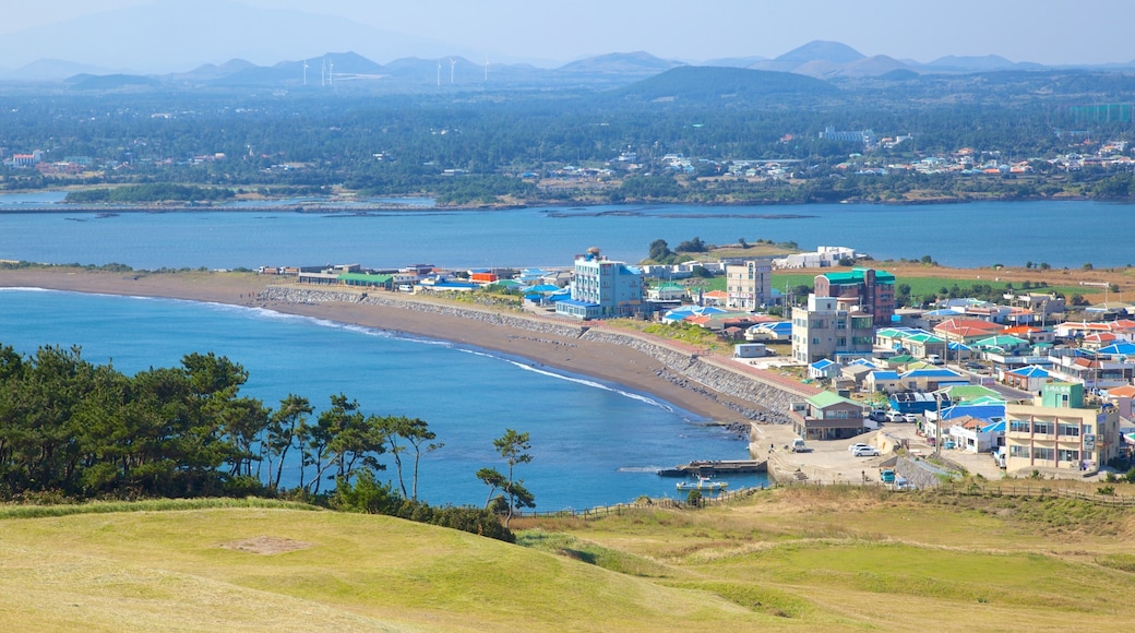 Seongsan Ilchulbong featuring a coastal town and landscape views