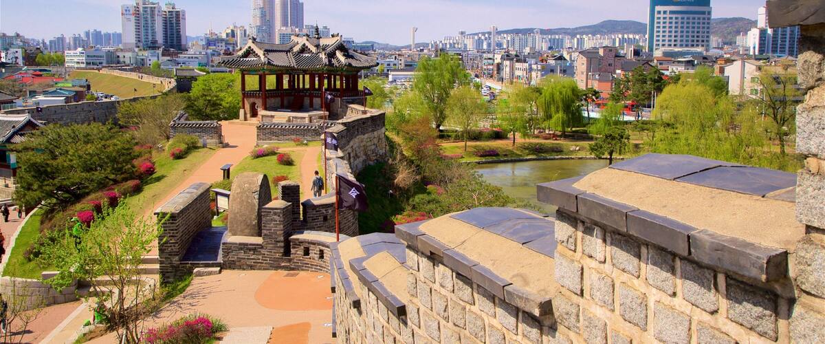 Hwaseong Fortress featuring heritage elements, a city and a park