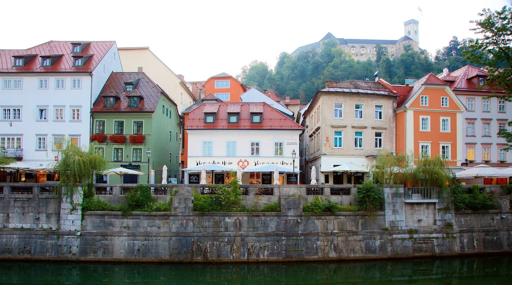 Ljubljana Castle featuring a house and a river or creek