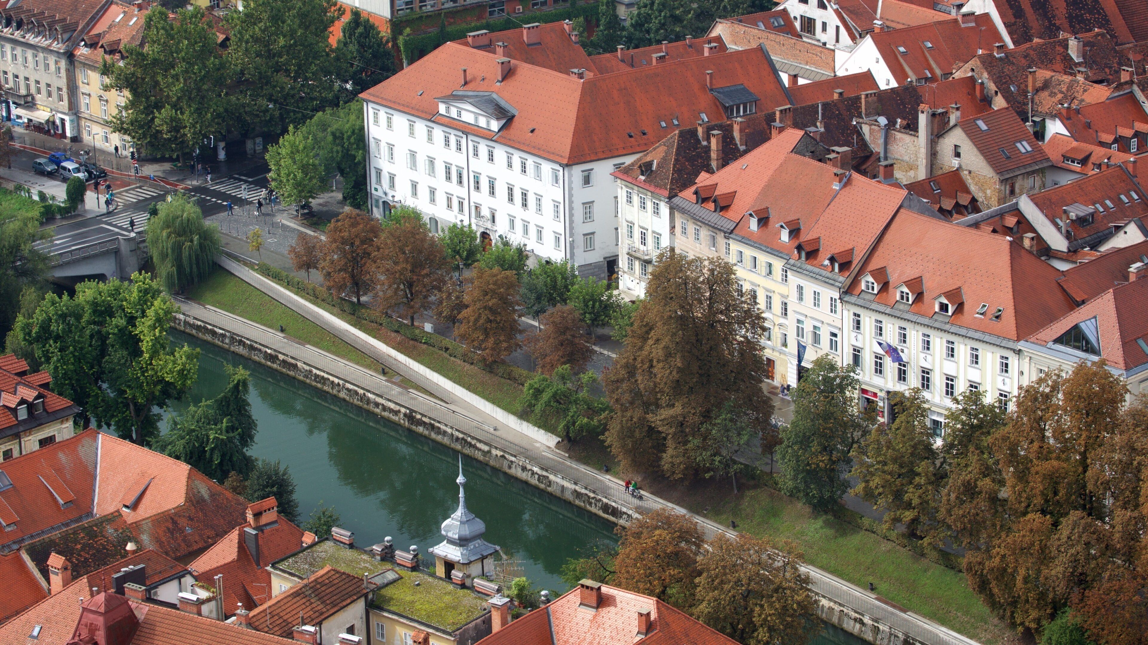 Ljubljana Castle which includes a river or creek, a city and chateau or palace