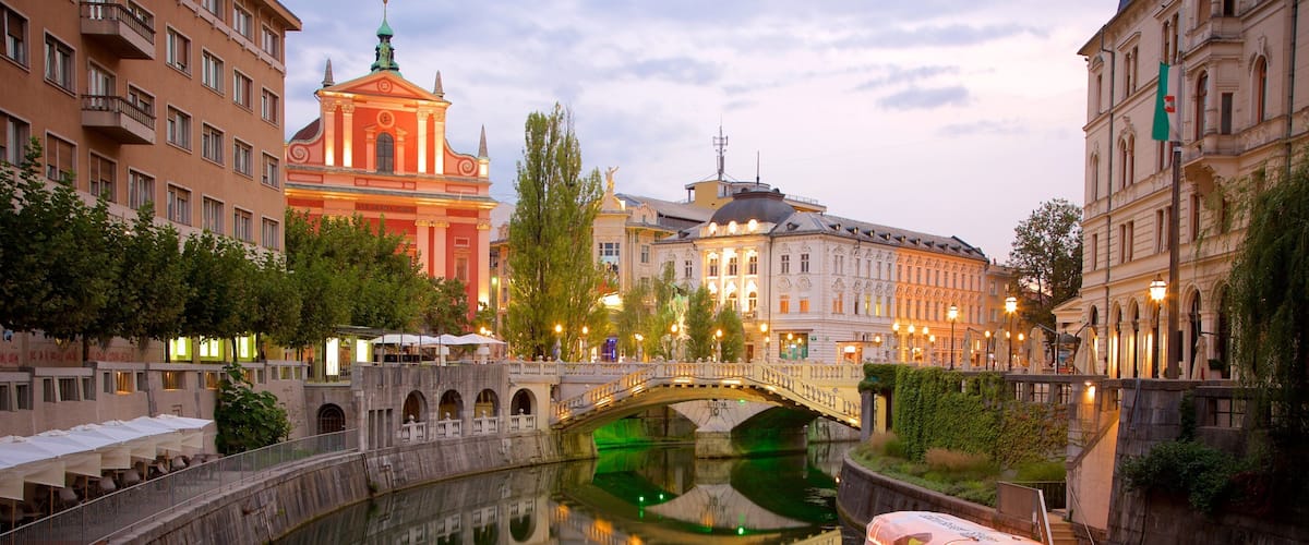 Triple Bridge which includes night scenes, a river or creek and a bridge
