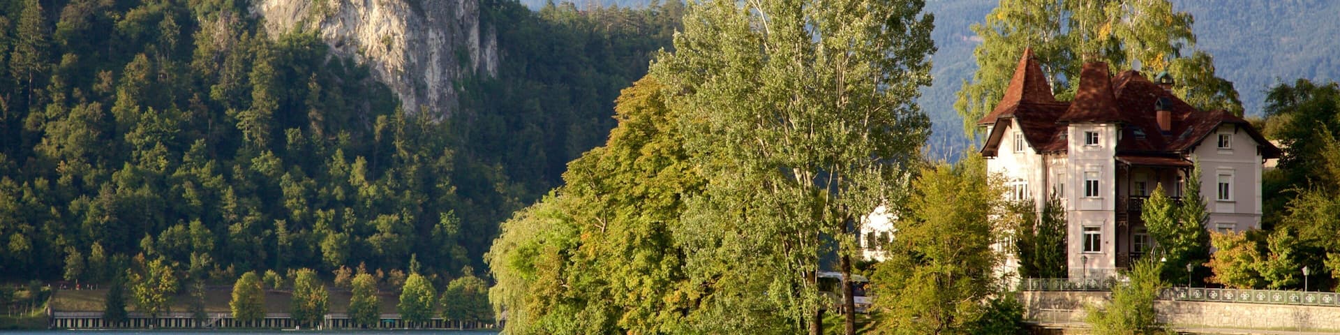 Lake Bled featuring a lake or waterhole and mountains