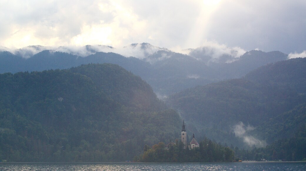 Church of Sv Marika Bozja which includes a church or cathedral, a lake or waterhole and mist or fog