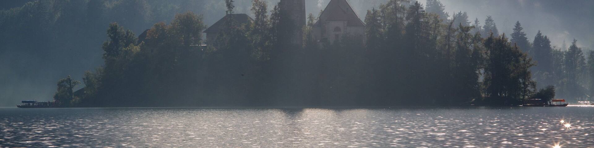 Church of Sv Marika Bozja featuring a lake or waterhole, a castle and mist or fog
