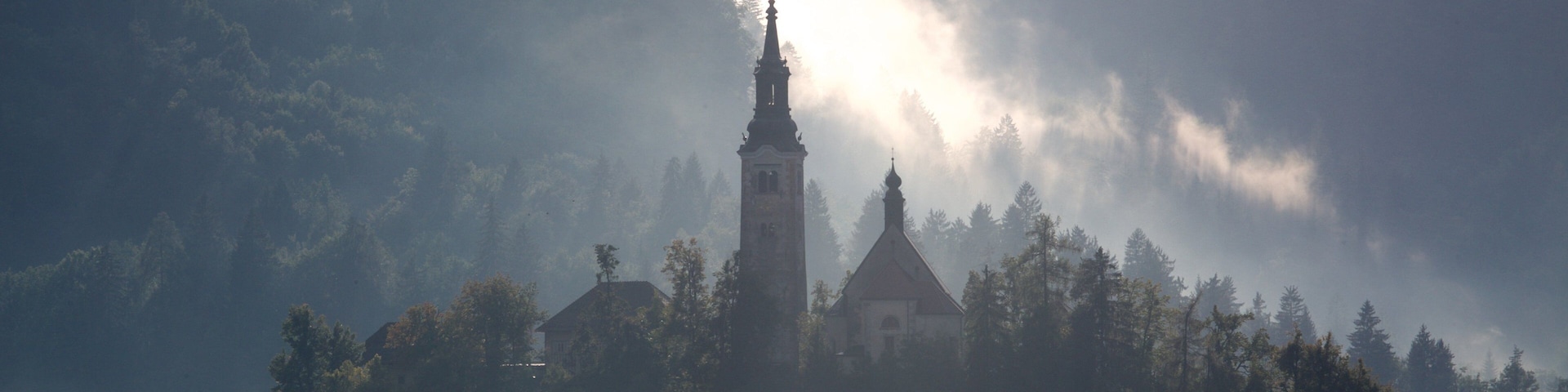 Church of Sv Marika Bozja featuring a lake or waterhole, a castle and mist or fog